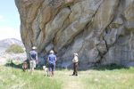 Park visitors looking at register rock, a large rock where emigrants sign on their travels