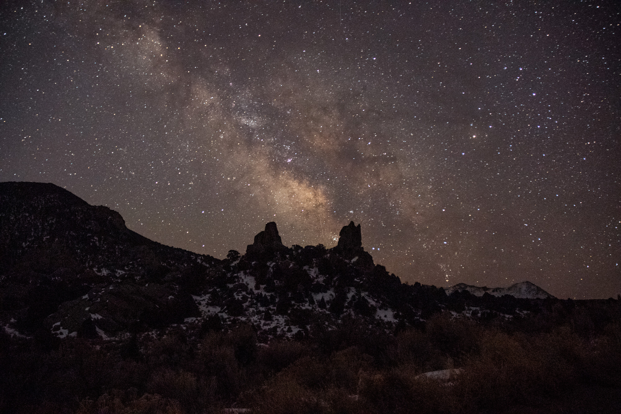 Night sky above castle rocks state park. purple-ish hues and galaxy