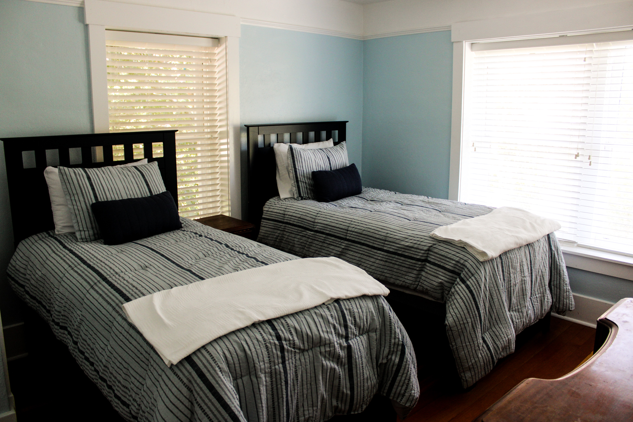 Blue room with two double beds