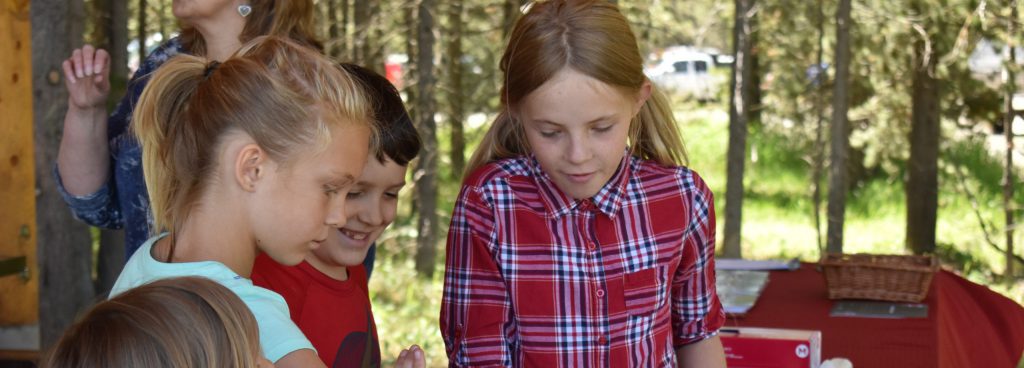 group of children making a grizzly bear mold