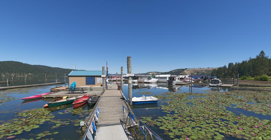 rowbaots, kayaks paddleboats and canoes at dock on lake