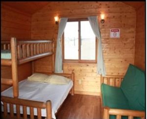 Interior view of the cabin, bunk of left, futon on right