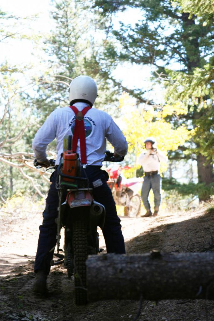 ranger on dirtbike on trail