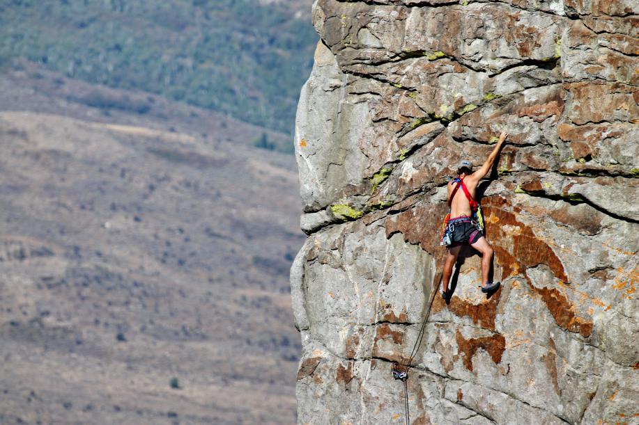 person climbing rock