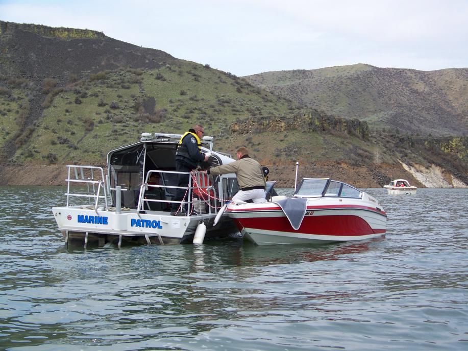 boat law enforcement pulling over a boat