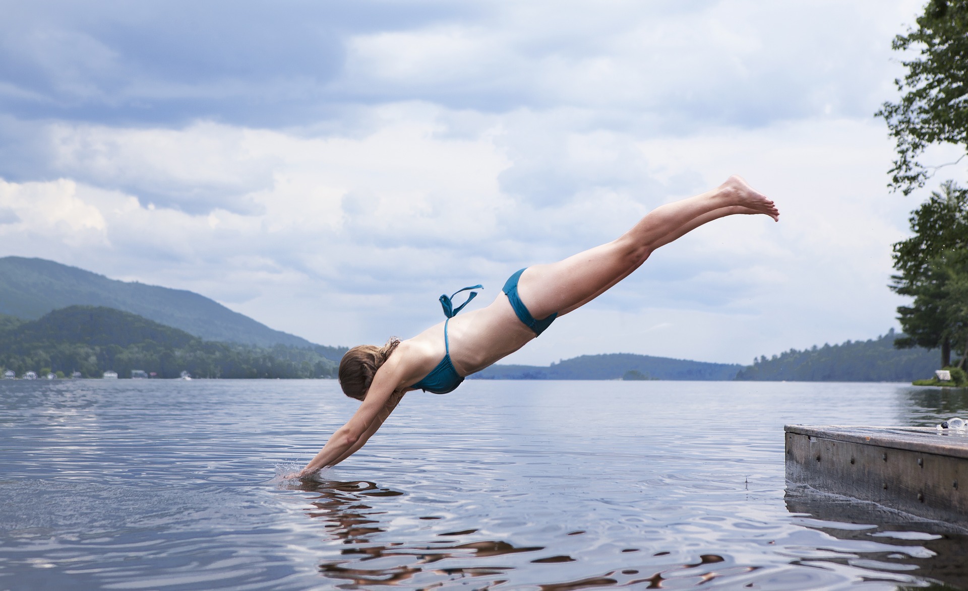 Woman diving off a dock