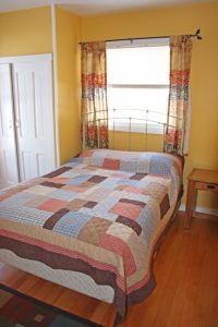 bed with quilt on it