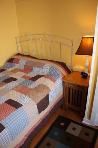 bed with quilt on it