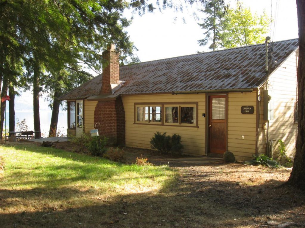 cottage with trees near