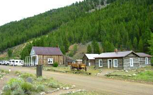 cabins infront of hill with trees