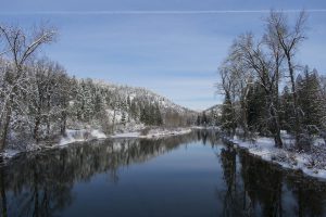 winter view from the trail of the river and snowy landscape