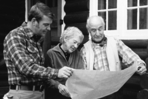 three people looking at a map